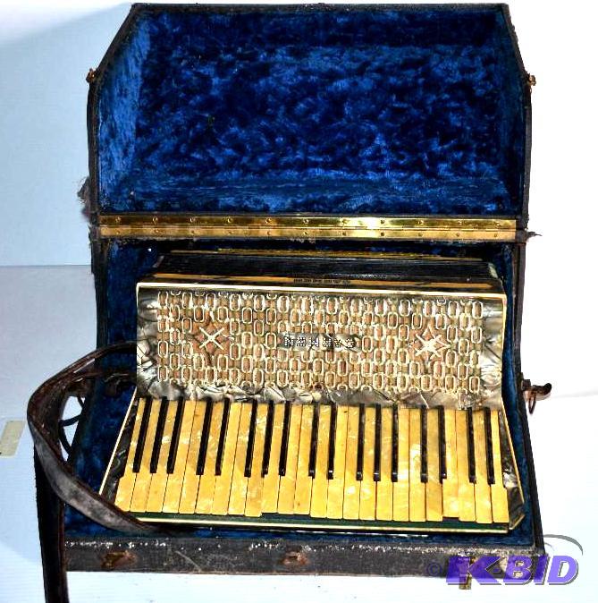 lot 1 image: Carmen Accordion with case- We think its a Ho...