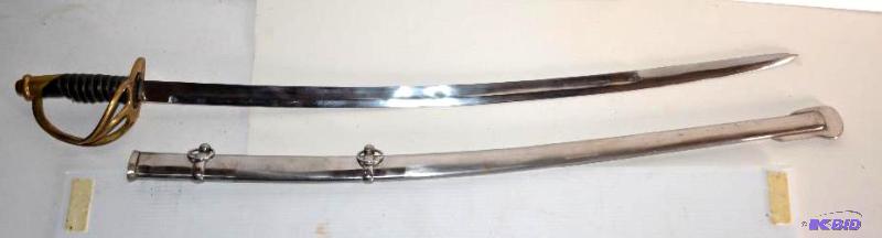 lot 10 image: Curved Sword with brass and black handle scab...