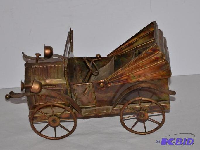 lot 124 image: Metal car 8" long and other metal items...