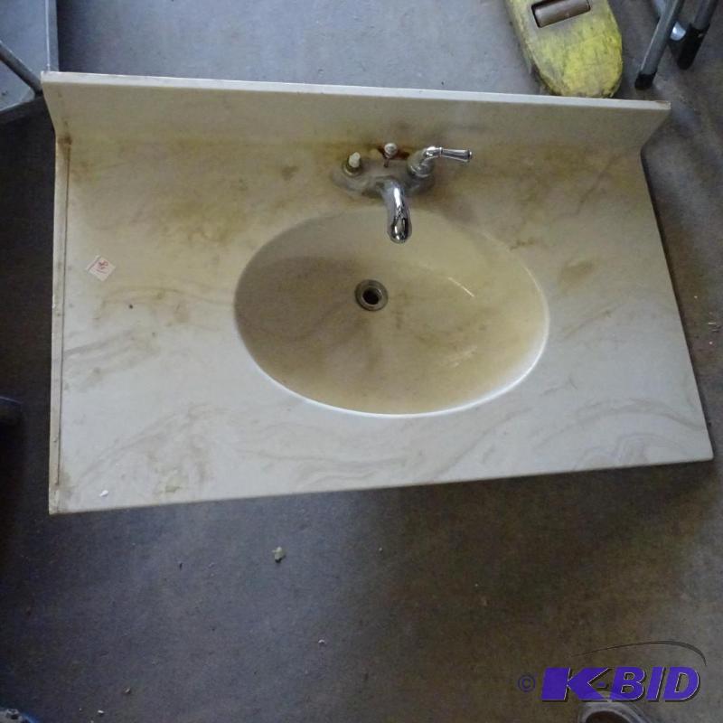 Used cultured marble sink, white with beige s...