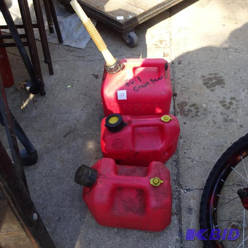 lot 31 image: 2 Gal. Gas Can. 2 Gas Cans 1 Gal...