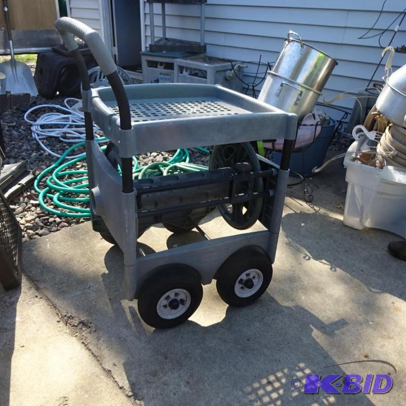 lot 35 image: Suncast Hose Caddy and GardenCart. Air Tires...