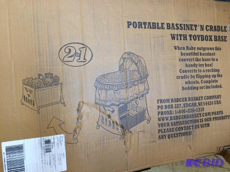 white portable bassinet and craddle with toy box base  retail $99