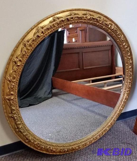 lot 11 image: Large Round Beveled Glass Gold Framed Mirror.
