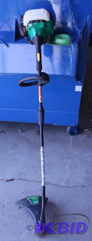 lot 13 image: Weed Eater Featherlite Curved Gas Trimmer.  Tested Works great.
