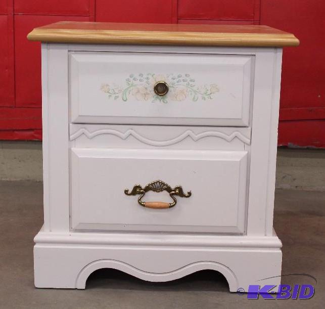 lot 20 image: Small White 2 drawer Night stand with Floral decor on drawer.  Drawers roll Smooth