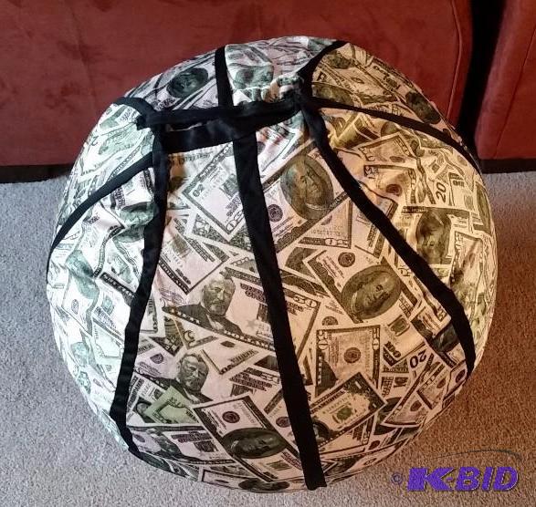 lot 34 image: Large Exercise Ball with Fuax Velvet Cover with Money motif.