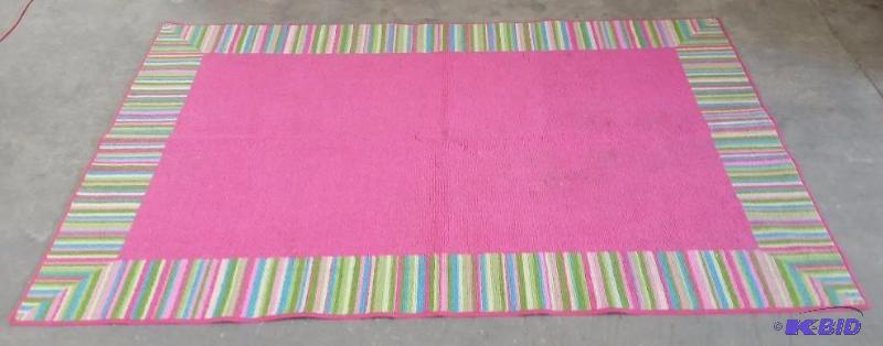 lot 37 image: Large Pink and Green Girls Area Rug.  A few stains see pics.  74 x 48