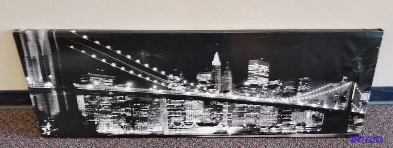 lot 61 image: Large Print of Brooklyn Bridge.  Has a wrinkled corner.  Still looks good hanging on wall.