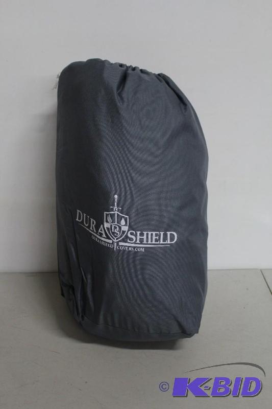 lot 18 image: DuraShield Pontoon boat cover. Includes strap...