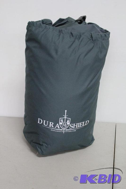lot 66 image: DuraShield Pontoon boat cover. Includes strap...
