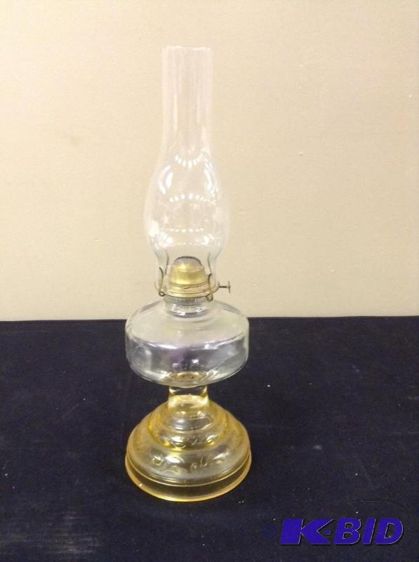 lot 17 image: Vintage Yellow & Clear Glass Oil Lamp