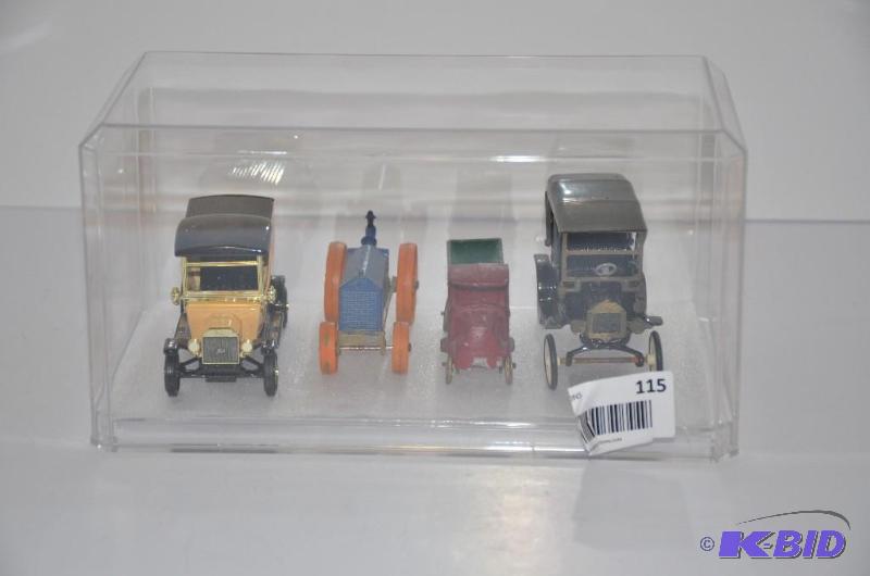lot 115 image: Collectible models of antique cars in display...