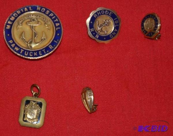 lot 199 image: Four pins are marked gold and one is not mark...