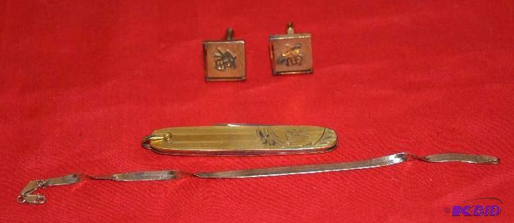 lot 202 image: 14 K gold cuff links, and knife that reads to...