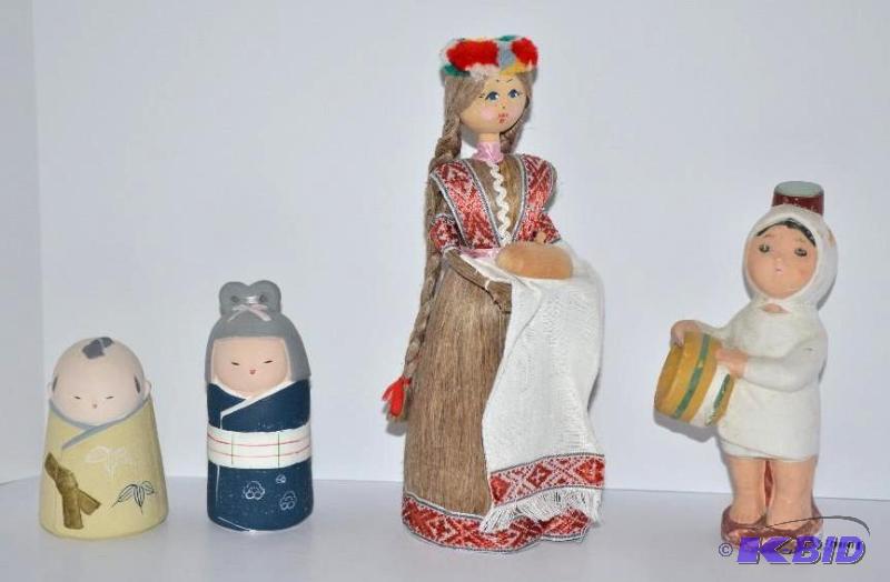 lot 59 image: 4 wooden dolls. The tallest is 10" tall...