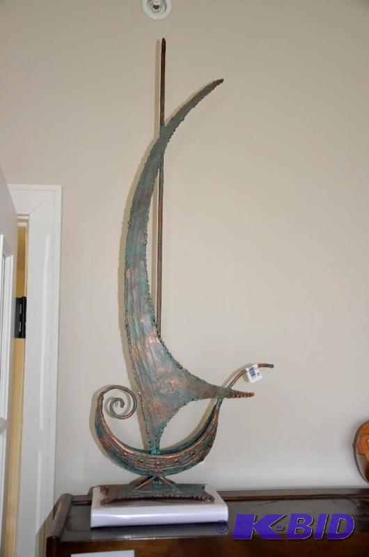 lot 81 image: Copper sculpture boat 36" tall....