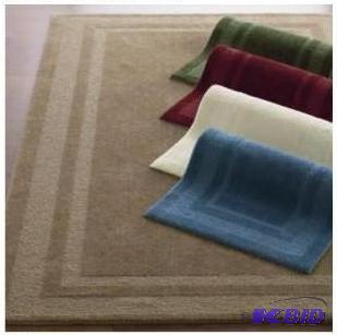 lot 47 image: Solid Cream Colored.  Washable. Double Border Rug.  Size 2 x 3 4.  Appears New in Package.
