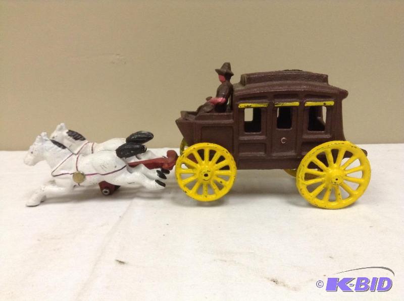 lot 100 image: Vintage cast iron stagecoach drown by two horses