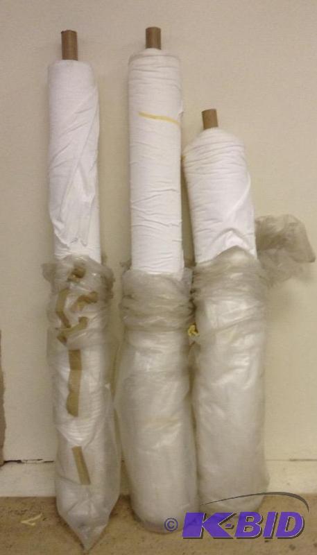Three bolts of white t-shirt type fabric