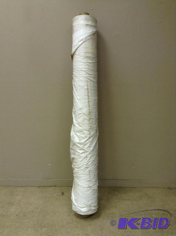 Bolt of white fabric with backing
