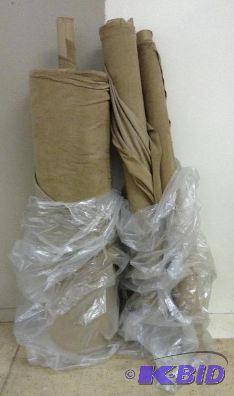 Three bolts of tan fleece fabric