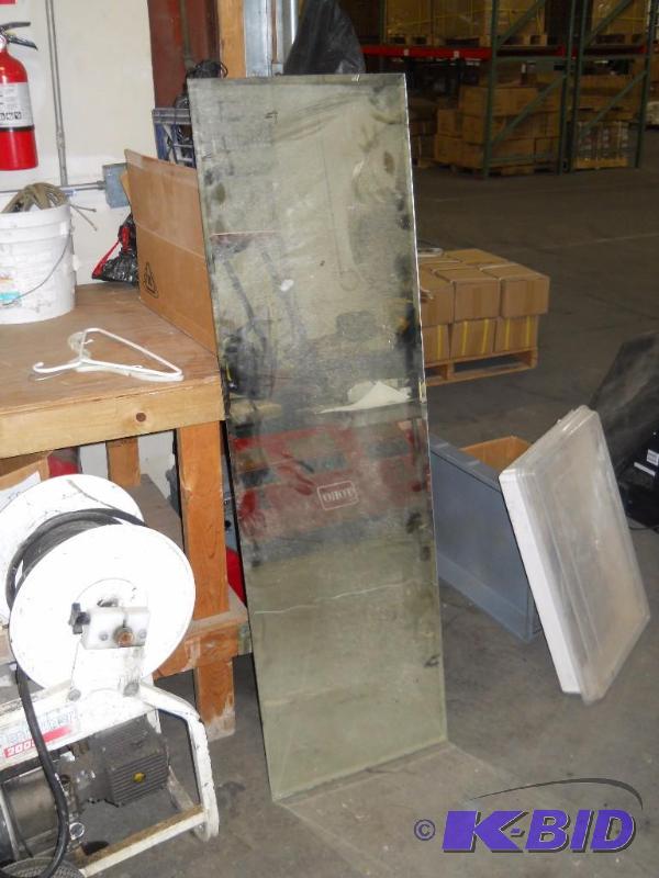 lot 54 image: 18  x 60 Beveled Glass Mirror. Dirty But Intact.