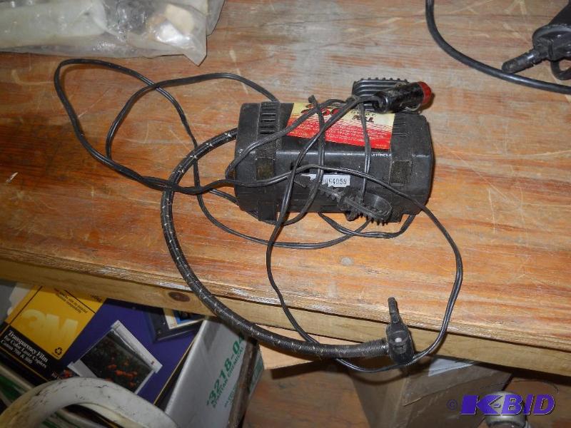 lot 7 image: 12 Volt 250 PSI Air Compressor. Plugs into Cigarette Lighter.