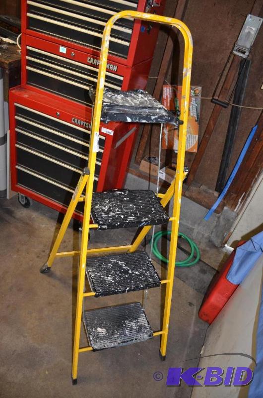 yellow step ladder with three steps...