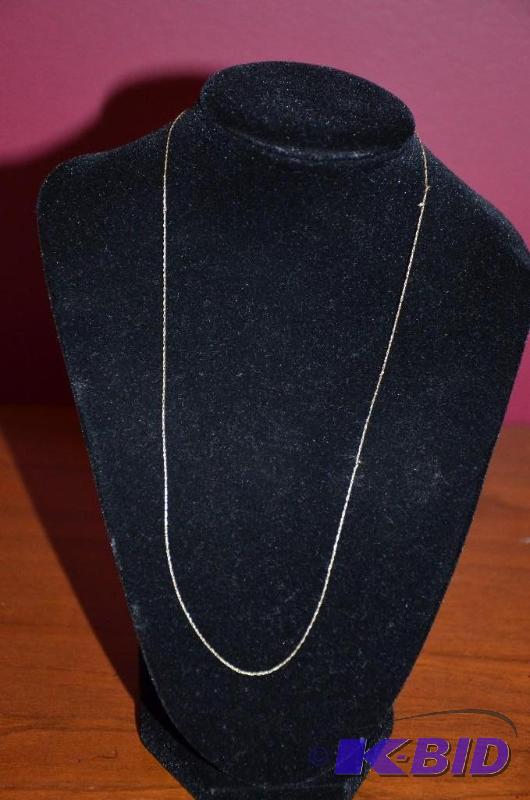 lot 181 image: 14k Gold Necklace and sterling silver piece. ...