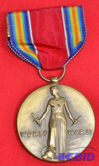 lot 41 image: Medal pendant from World War 2 we think. (say...