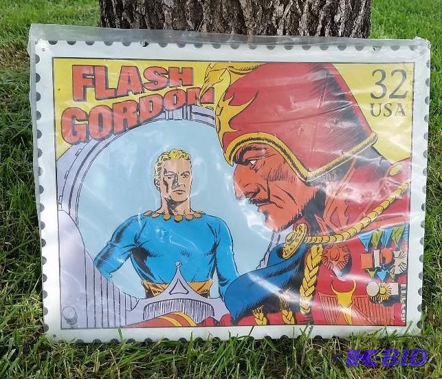 lot 35 image: Large Metal Flash Gordon Postage Stamp