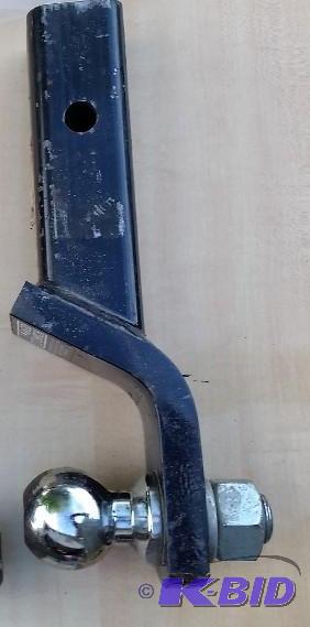 lot 51 image: Hitch with ball that has a 4 inch Rise, could be reversed to a 4 inch drop.  Has 2 inch receiver.