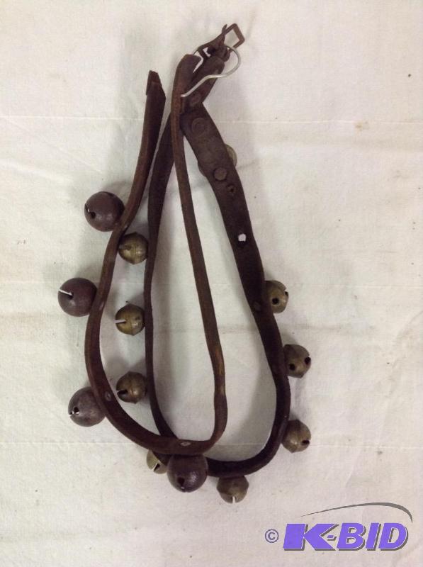 lot 73 image: Old Sleigh Bells on Leather Strap