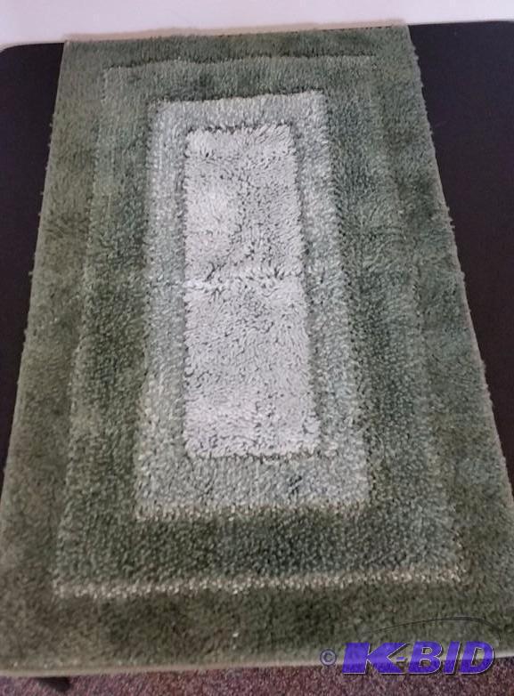 lot 49 image: JCP Home.  Large Shades of Green Bathroom Rug. 20 x 34