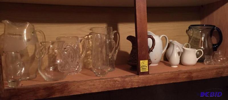 lot 50 image: Another Shelf of Pitchers Mostly Glass
