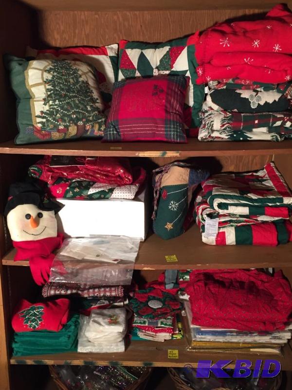 lot 92 image: Three Shelves of Christmas Linen Type Items