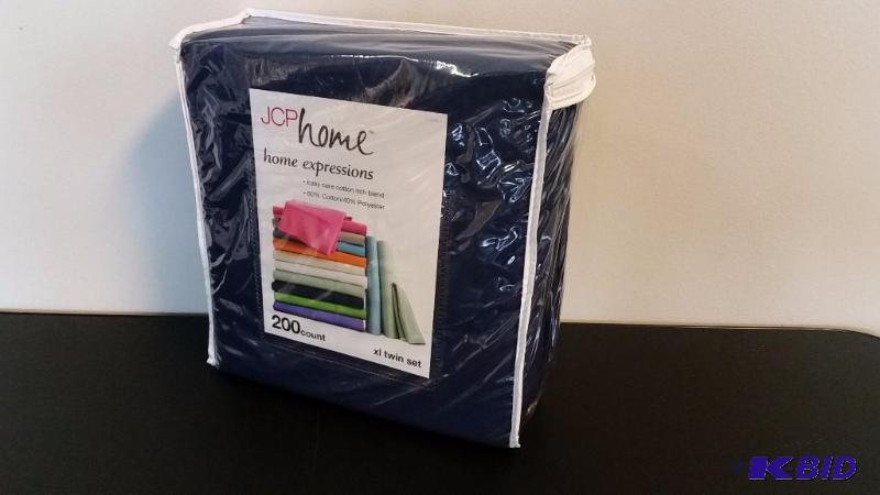 lot 23 image: JCP Home  Navy  XL TWIN Sheet Set.  Flat, Fitted and 1 Pillow cases.  Still in Package