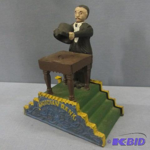 lot 32 image: Magician Cast Iron Bank