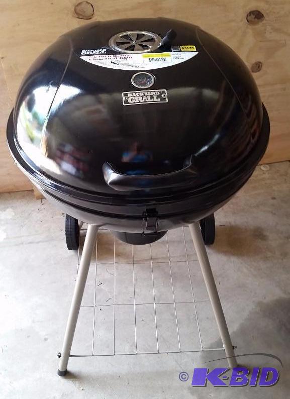 lot 44 image: Backyard Grill 22.5 Kettle Grill, Black.  Nice Shape.  Needs the grill you place food on.  Can Be purchased.