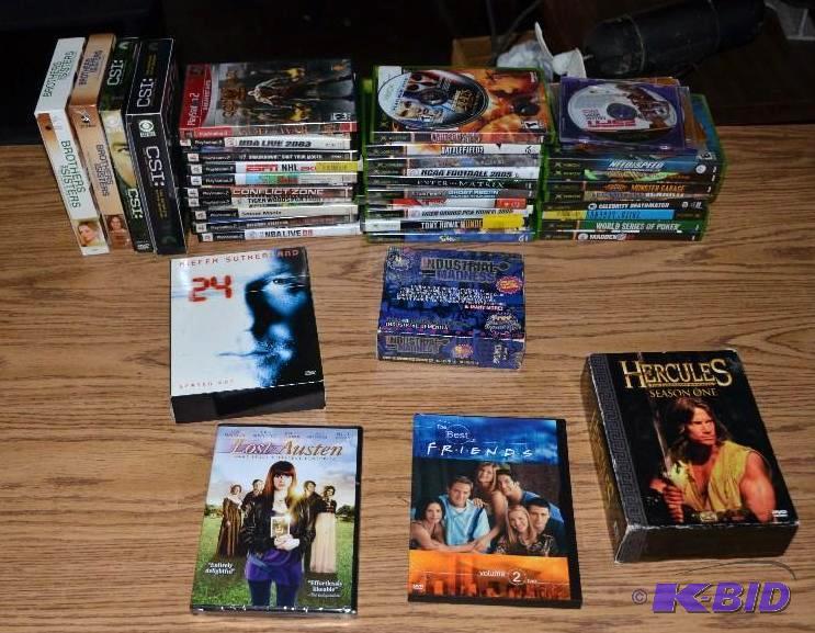 lot 91 image: Tub of games and DVDs - please inspect to mak...