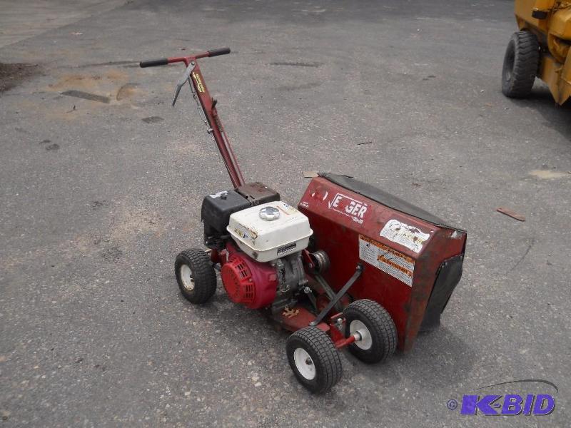 lot 5 image: Brown F991H Bed Edger. Starts and runs.