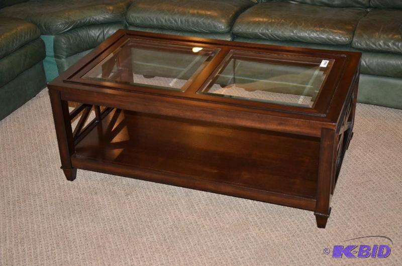 lot 95 image: Glass top Wood coffee Table measures 46 x 26 ...