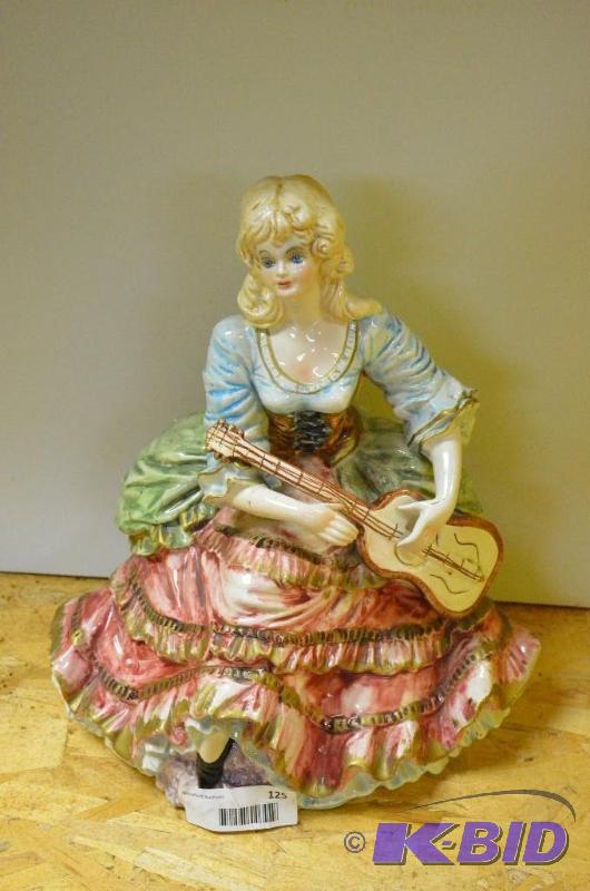 lot 125 image: Figurine. Does have repair but still a beauti...