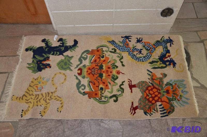 lot 77 image: Tibetan Rug Figural Rug with dragons tiger, m...