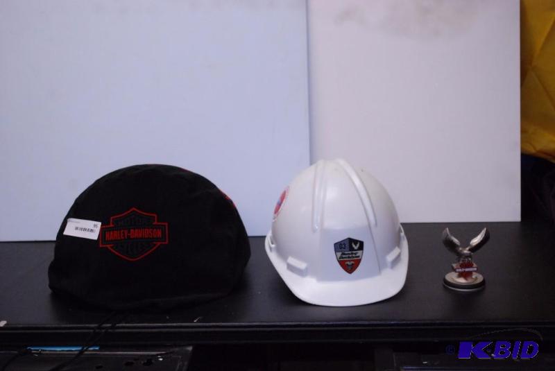 lot 95 image: Group of Harley Davidson helmets, awards, and...