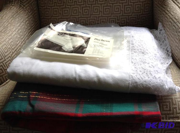 lot 135 image: Extra Large White Tablecloth and Holiday Plaid Tablecloth