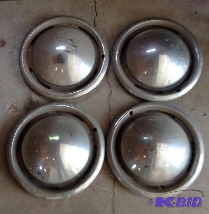 lot 192 image: Set of Four Vintage Baby Moon Hubcaps