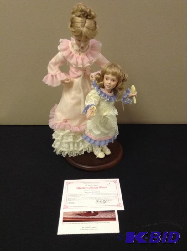 lot 19 image: Mothers Loving Touch Porcelain Doll