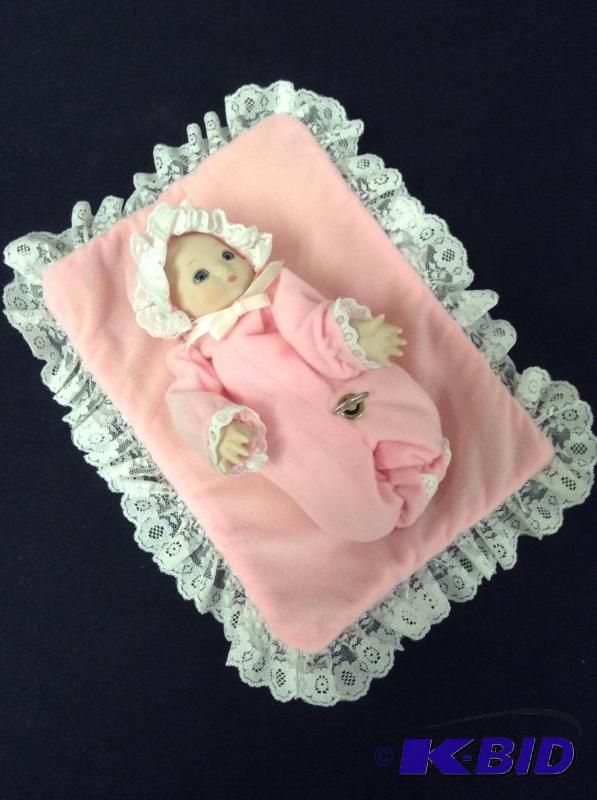 lot 28 image: Musical Porcelain Baby Doll